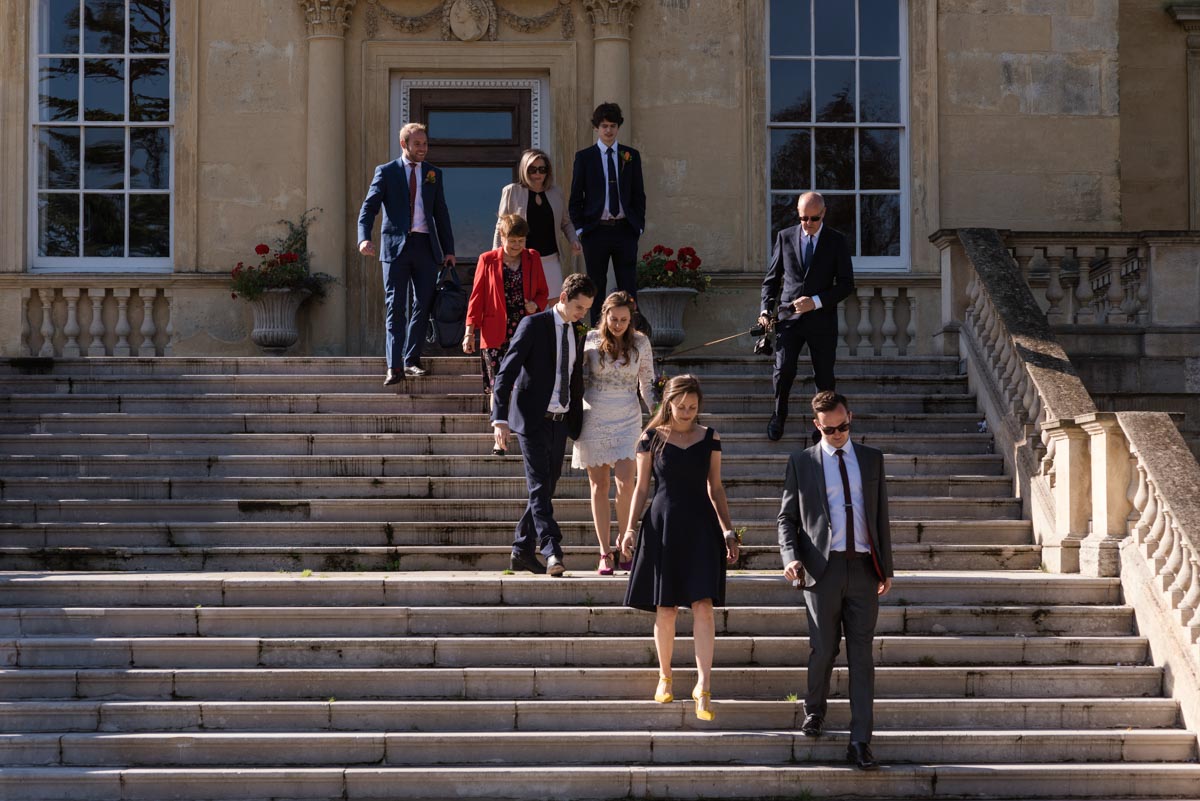 Alex and James with wedding guests outside Danson House in Kent