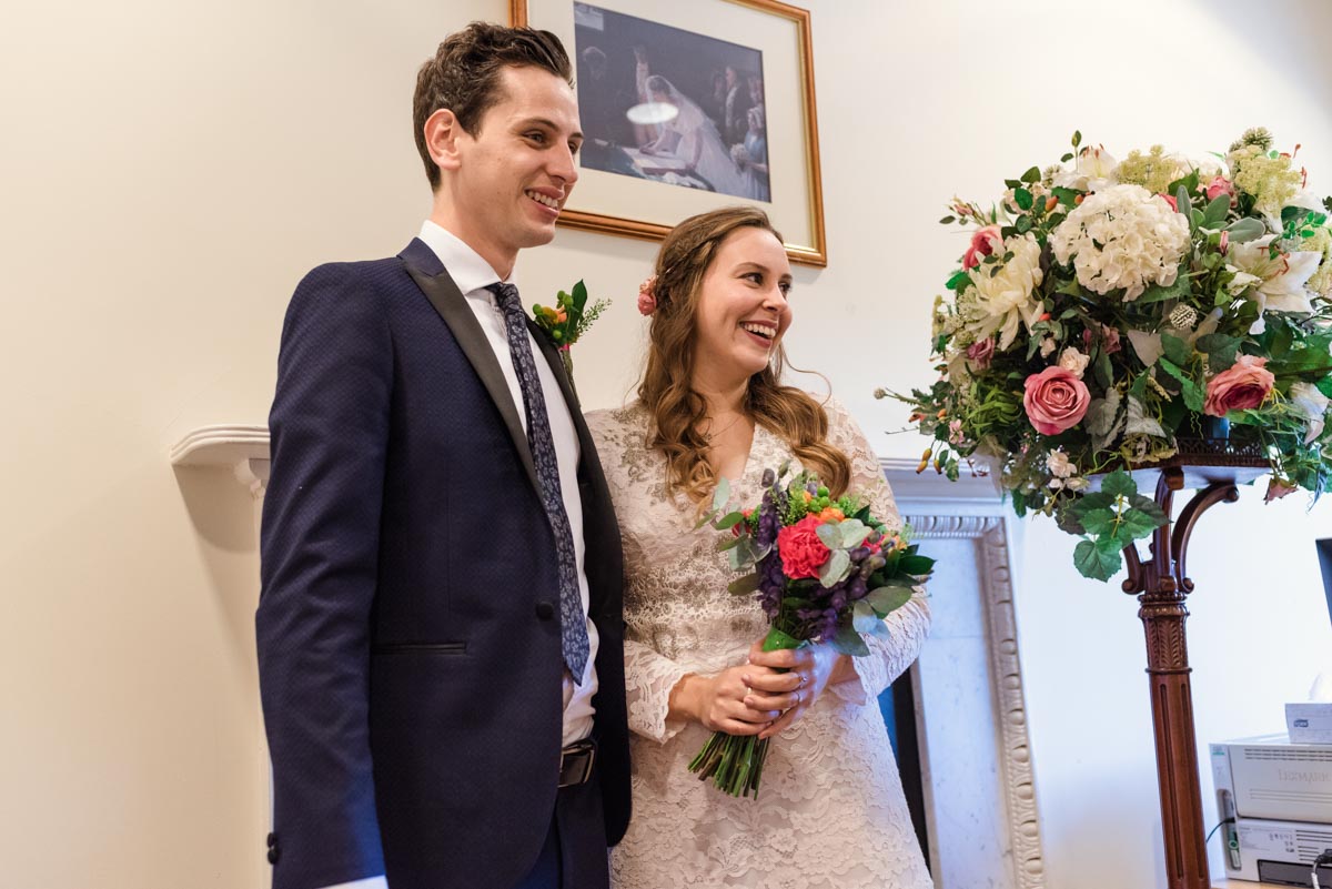 Photograph of Alex and James during their Danson House wedding ceremony