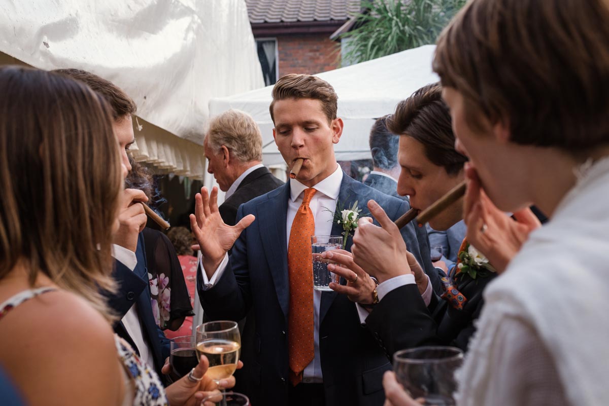 Stefan photographed smoking cigar during his wedding reception in Broadstairs