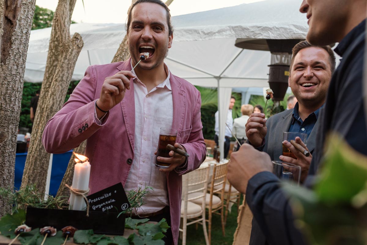 Photograph of wedding guests enjoying food