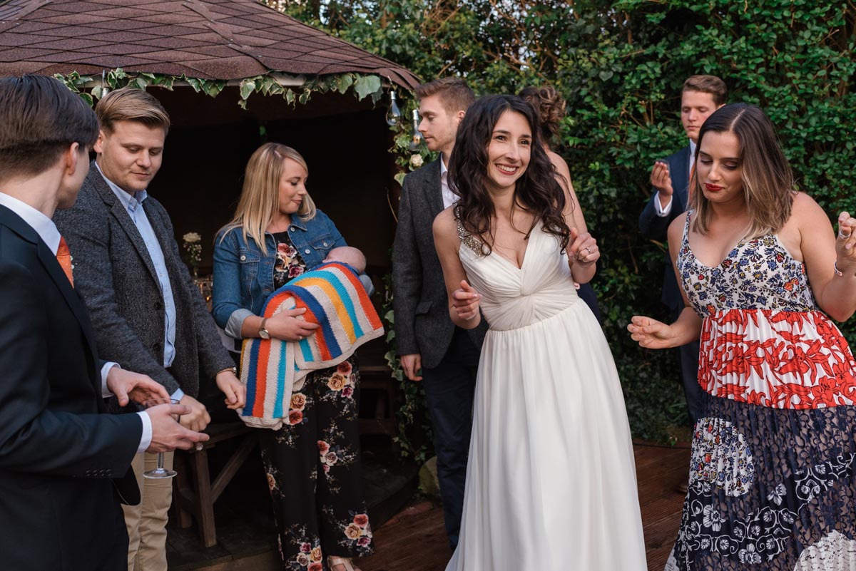 Claire and friends dancing and laughing at her wedding reception in Broadstairs