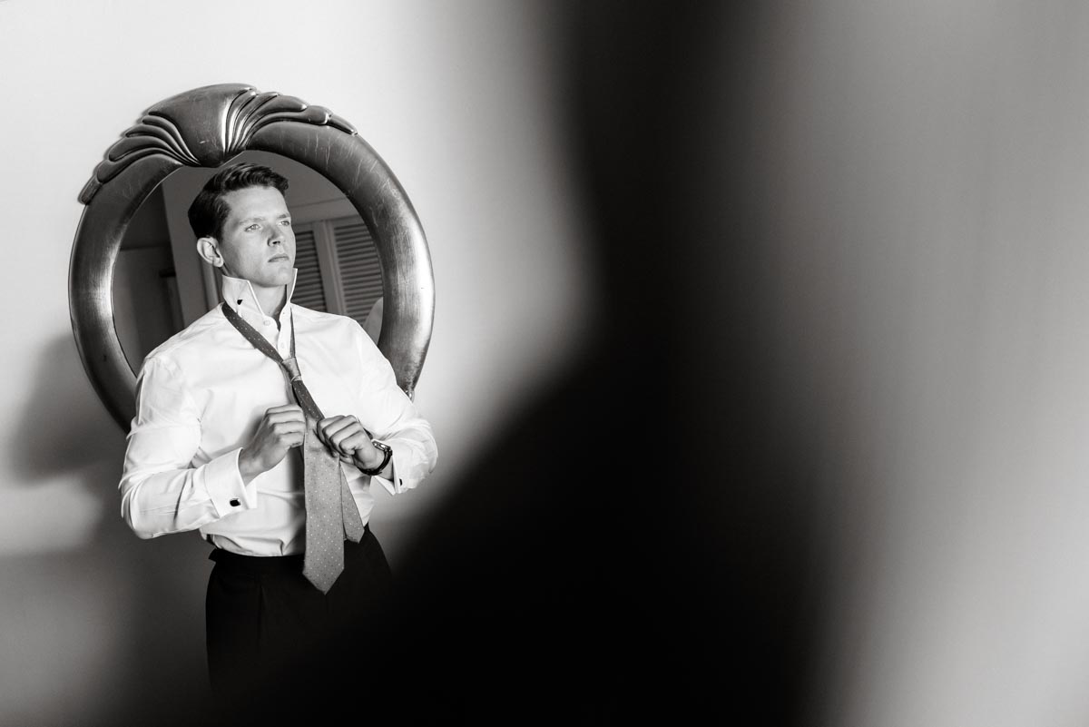 Black and white photograph of Stefan getting ready