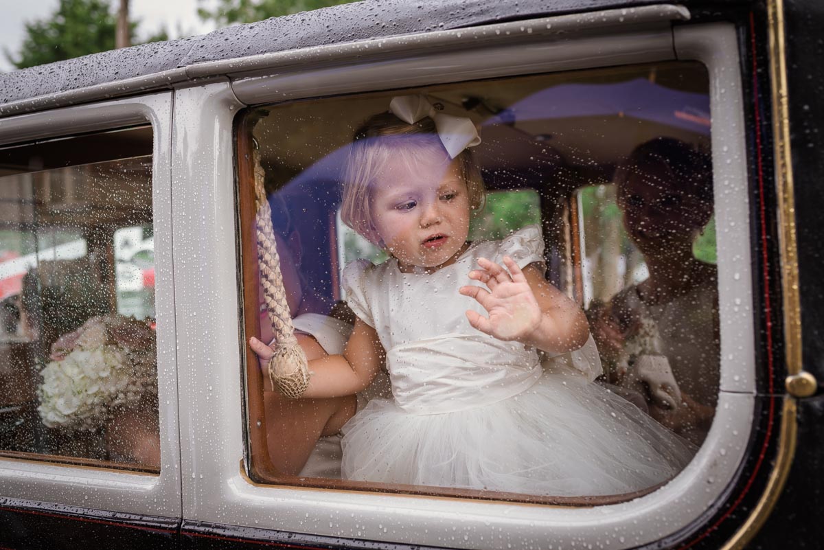 Photograph of flower girl in wedding car