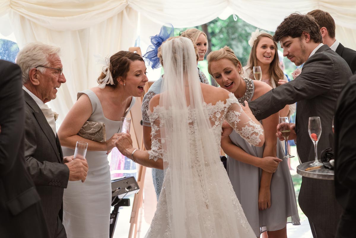 Photograph of guests admiring Rebeccas wedding ring