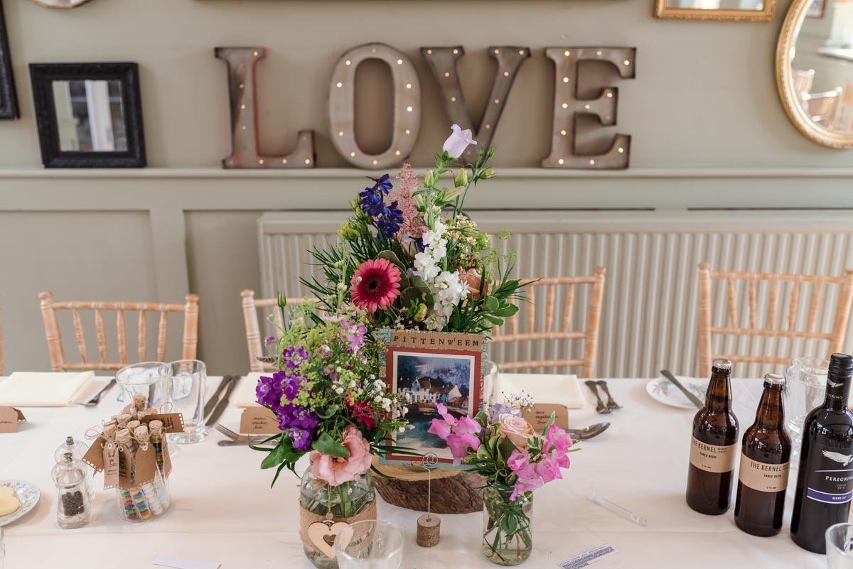 Photograph of table decorations at Sarah and Chris's secret garden wedding in Kent