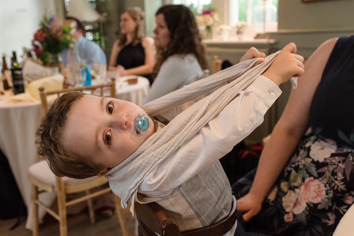 Photograph of little boy at sarah and Chris's secret garden wedding reception