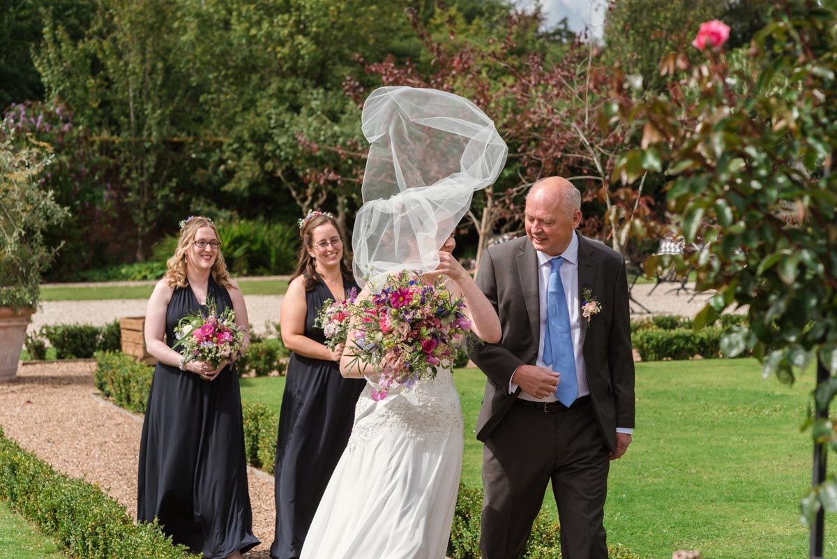 Photograph of sari's veil being taken by the wind