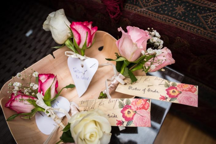 Photograph of pink and white rose button holes
