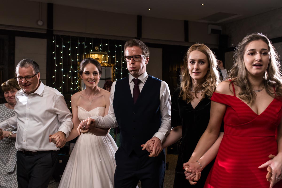 Kent wedding photographer Helen Batt photographs wedding ceilidh at Holdsworth House