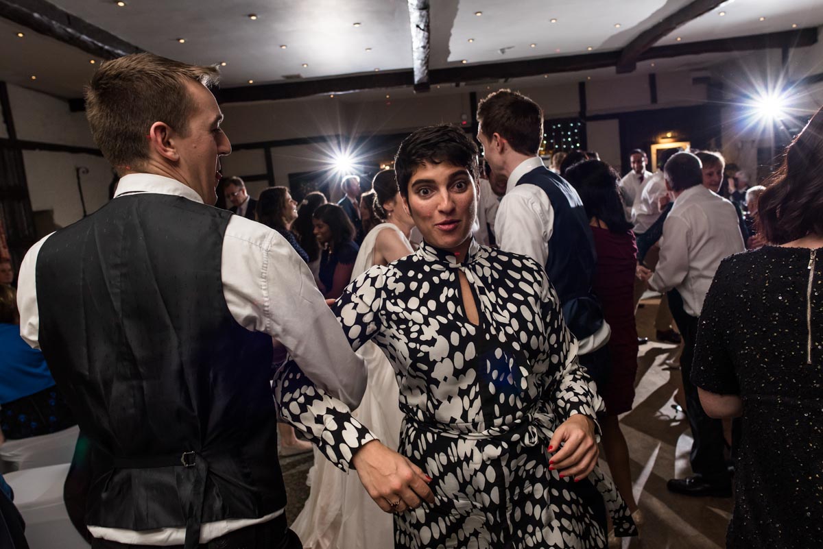 Wedding guests dancing at Holdsworth House reception