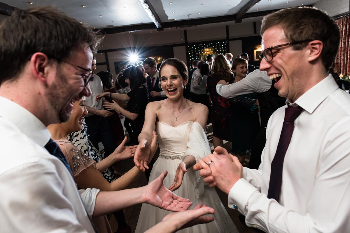 Katherine & Tom photographed dancing at their wedding reception