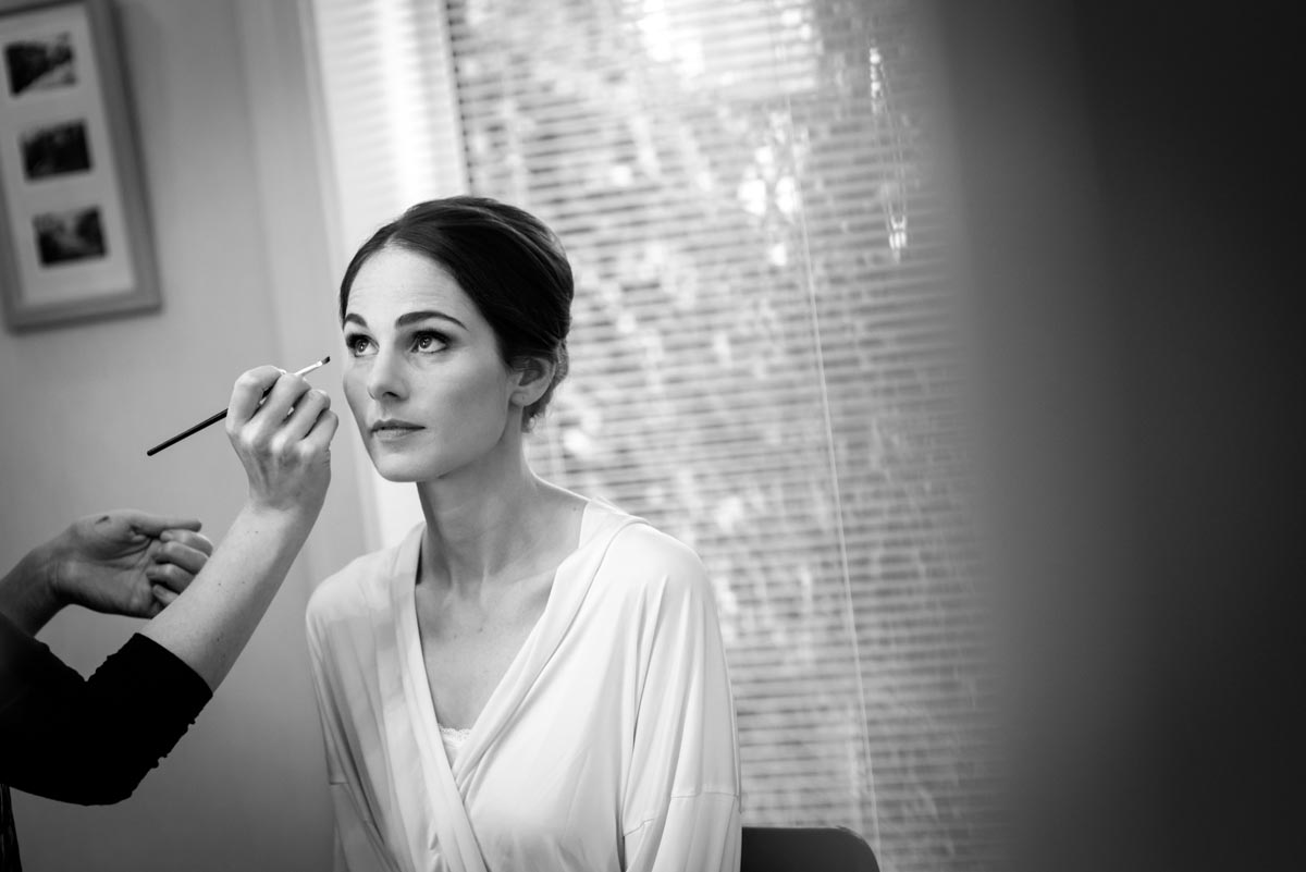 Katherine has her wedding make up applied