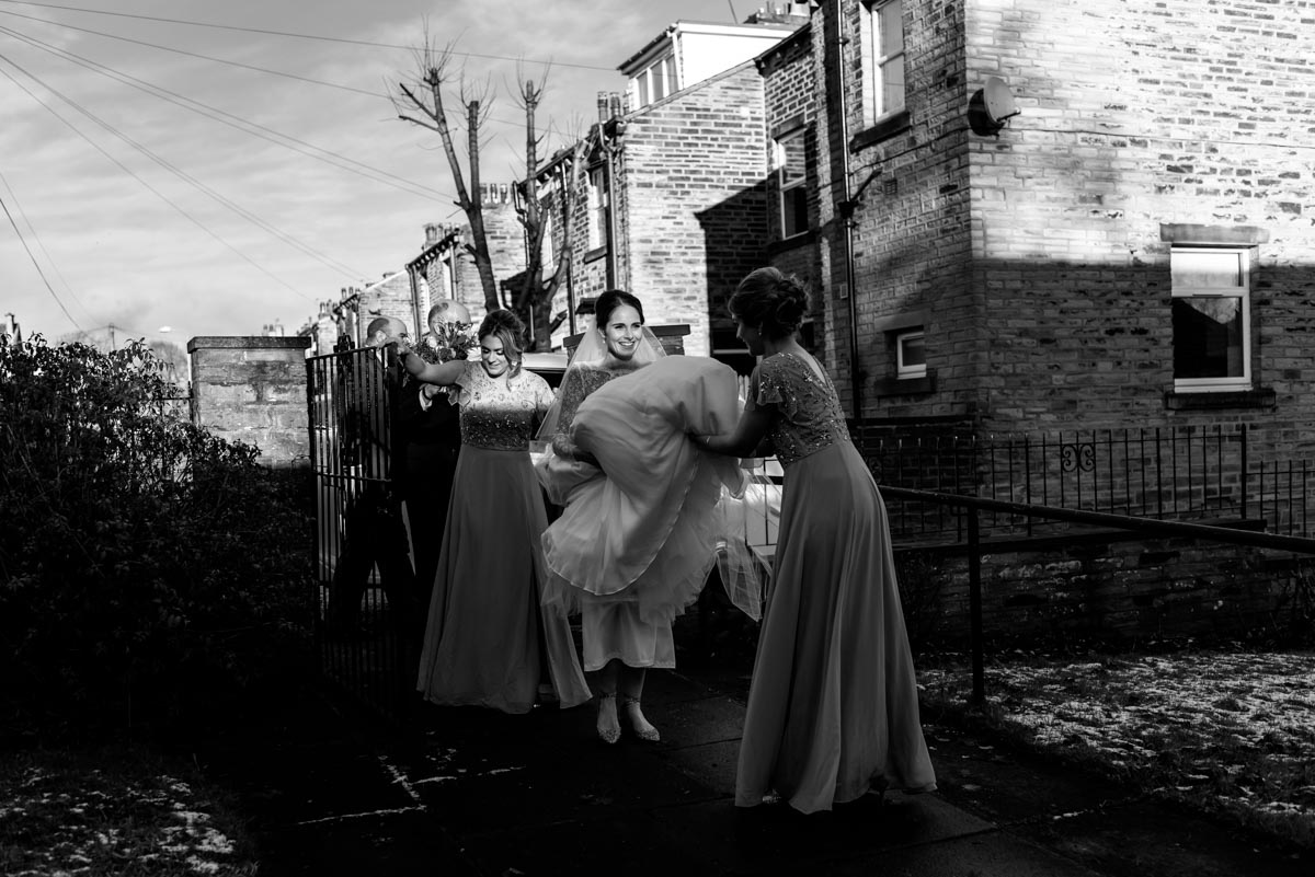 Photograph of Katherine and bridesmaids arriving at church