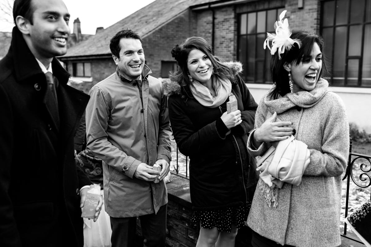 Photograph of wedding guests outside church on Katherine and Toms wedding day