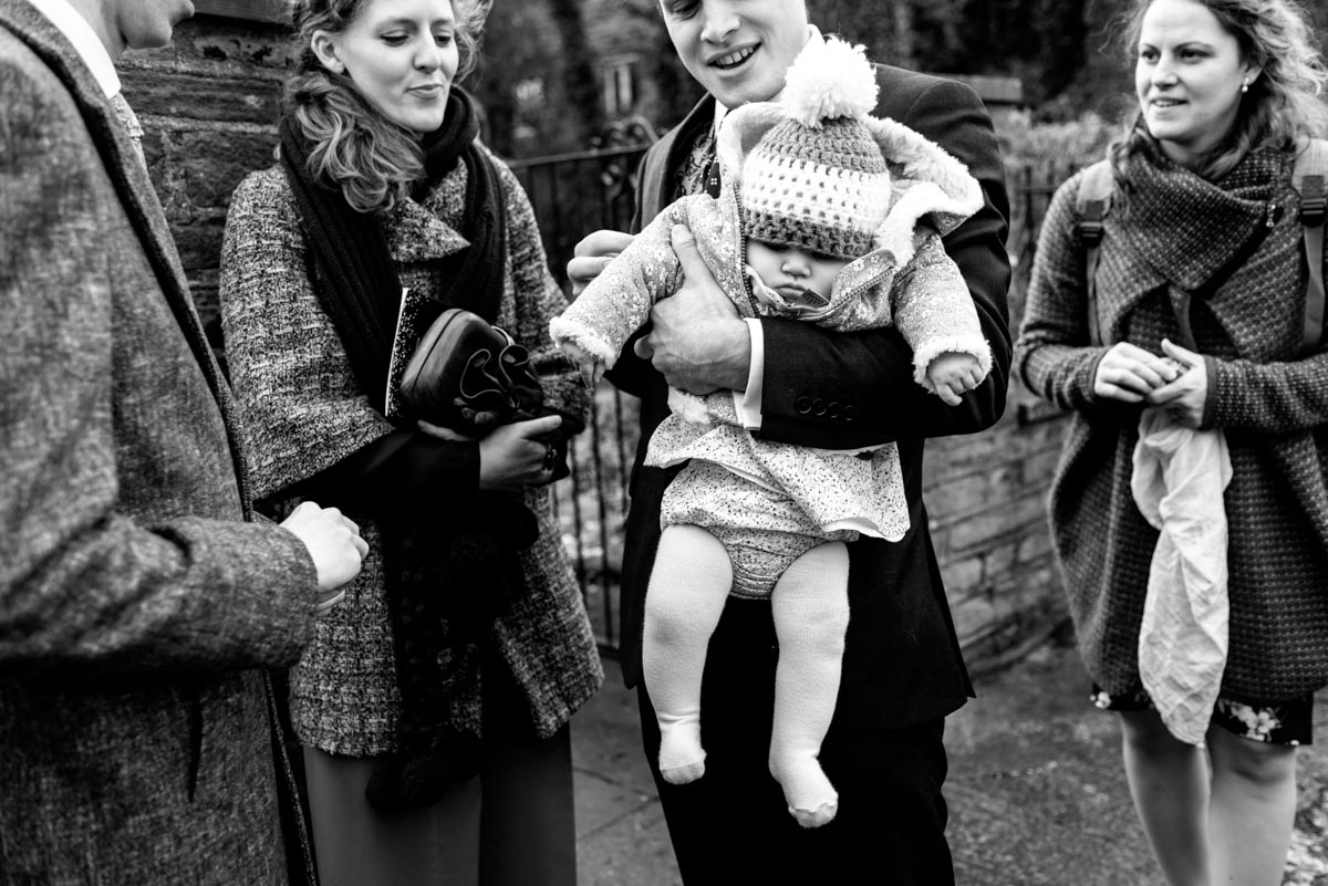 Photograph of baby in pompom hat on Katherine and toms wedding day