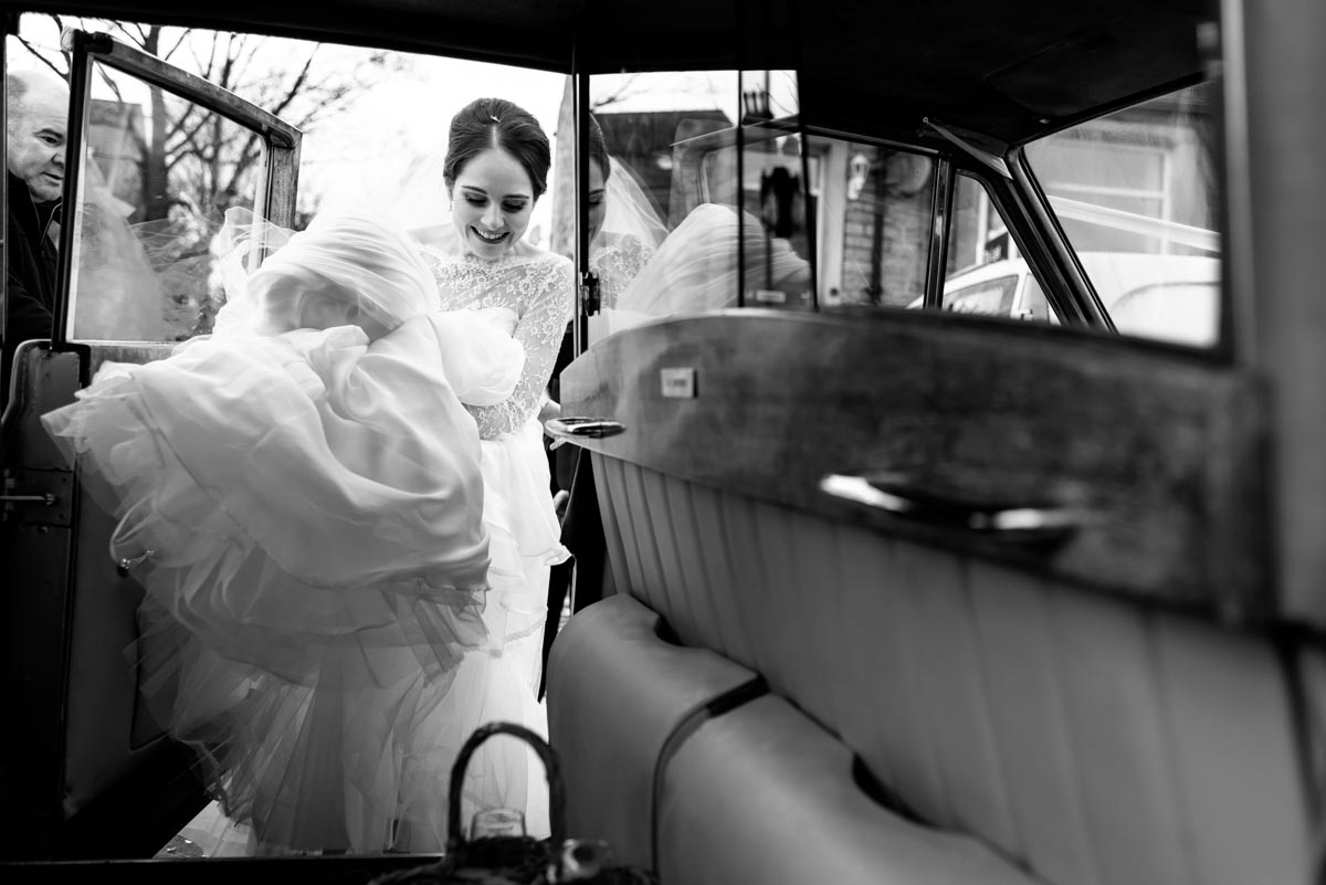 Photograph of Katehrine getting into wedding car