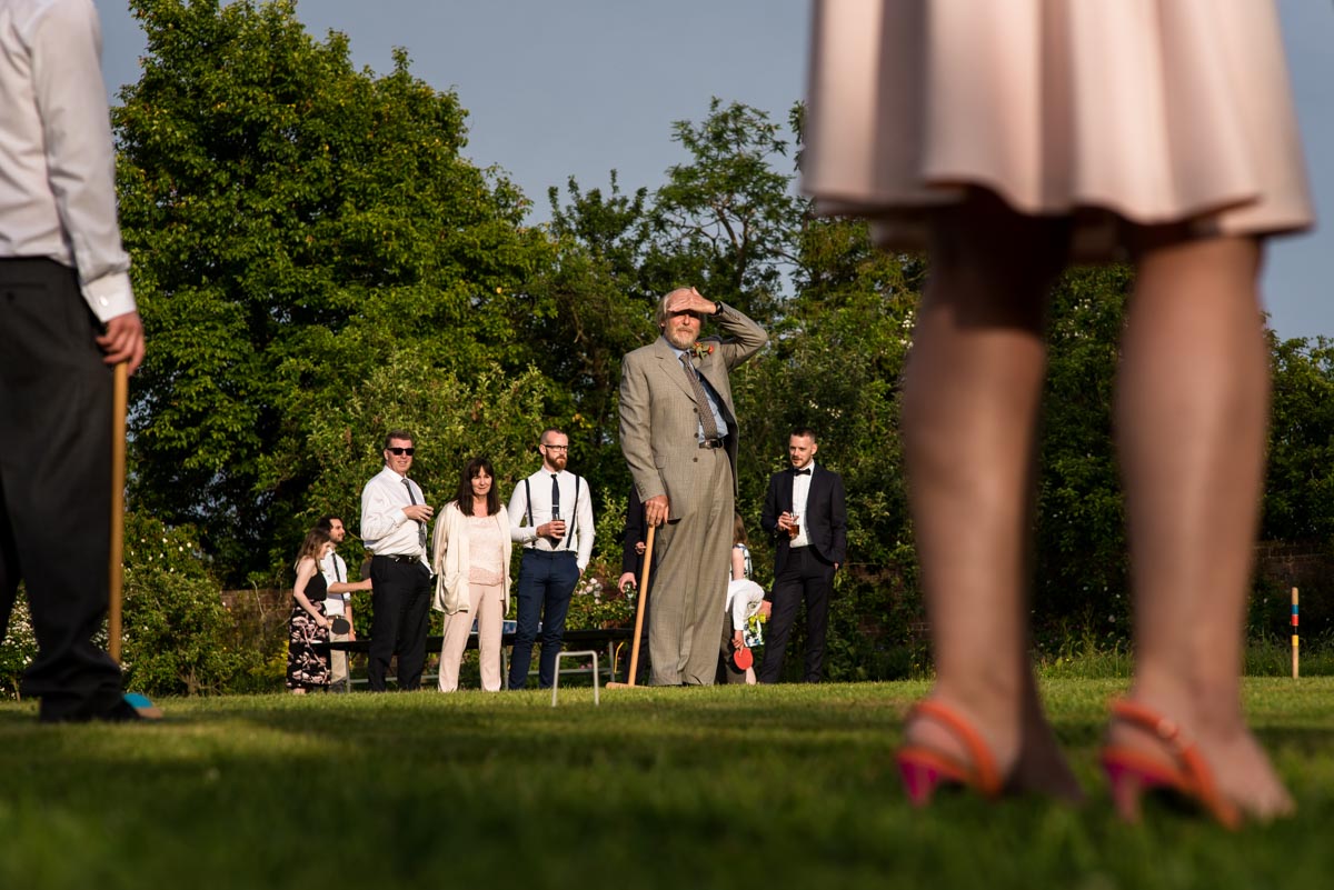 Wedding day game of croquet at Ratsbury Barn