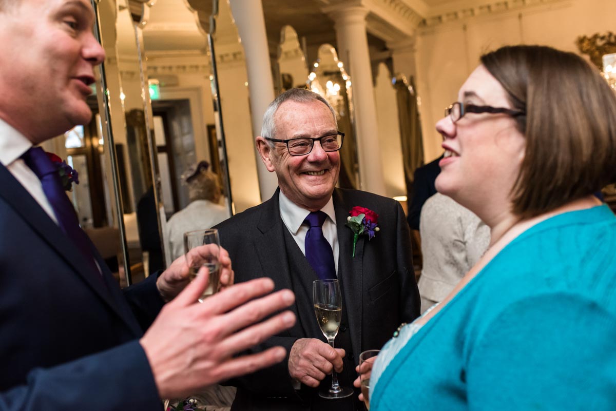 Photograph of Graham talking to wedding guests at chilston park hotel in kent