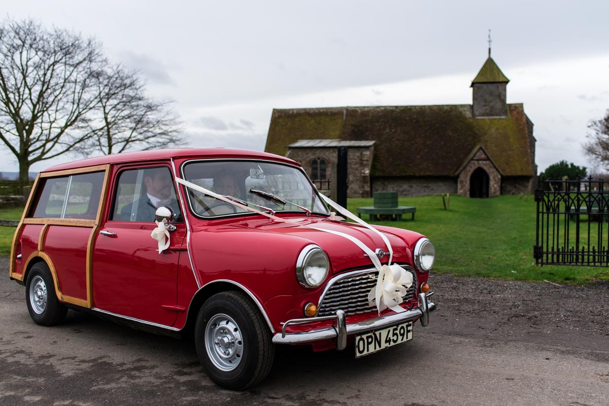Wedding car leaves with Rebecca and Stepehn for The Ferry House Inn in kent