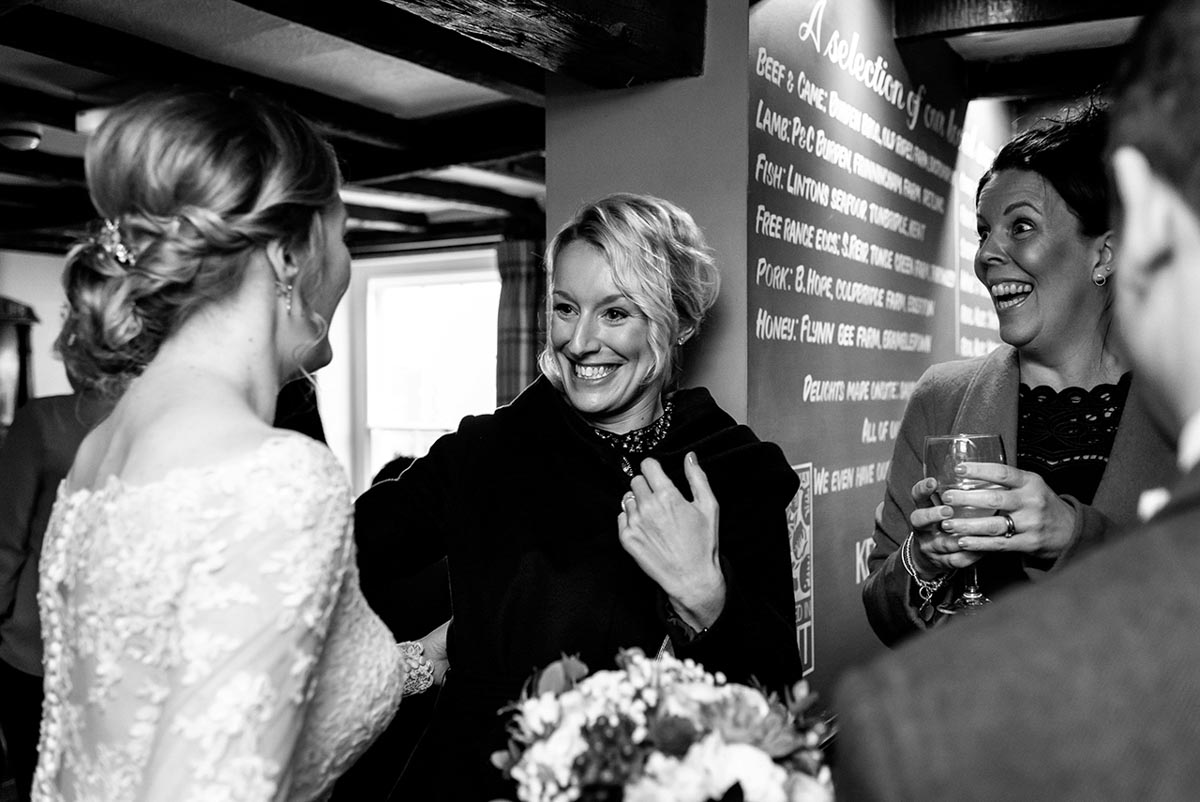 Wedding guests congratulate Rebecca on her wedding at the Ferry house Inn