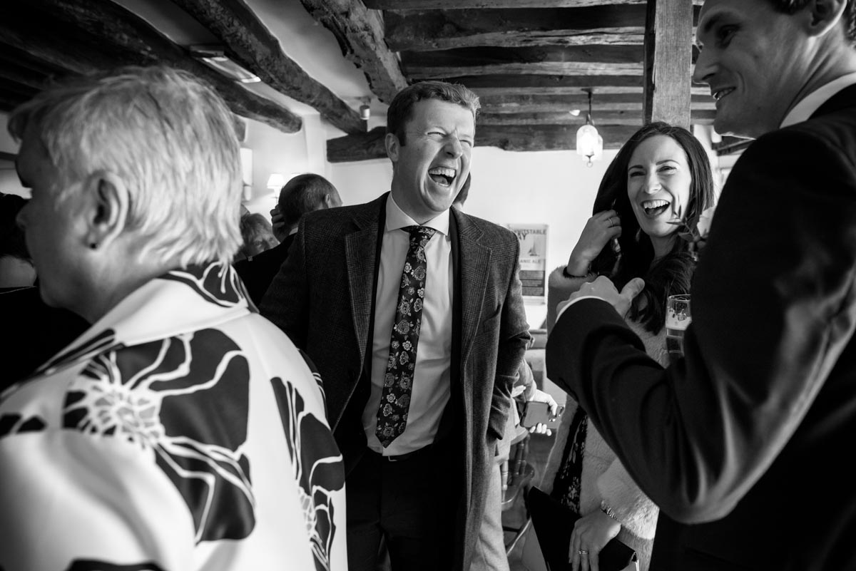 wedding guests photographed at Shepherd Neame Visitor centre in Faversham, Kent on Liam's wedding day