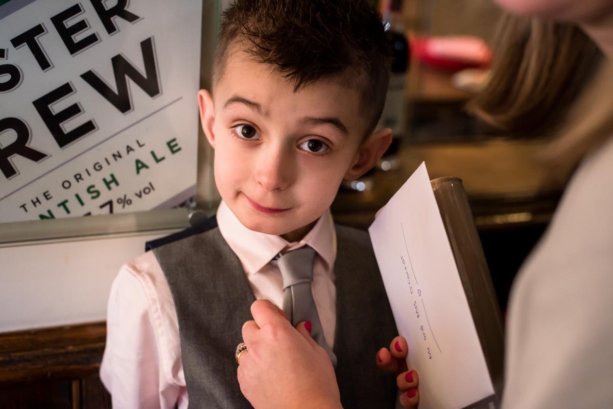 The Old Brewery Store wedding photography, little boy has his tie adjusted