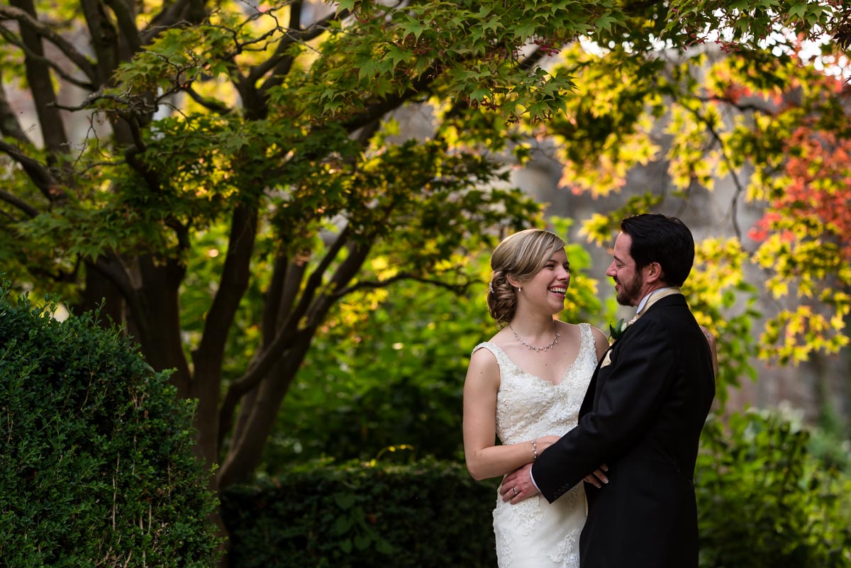 Bride and groom photographed in the grounds of Eastwell Manor on their wedding day