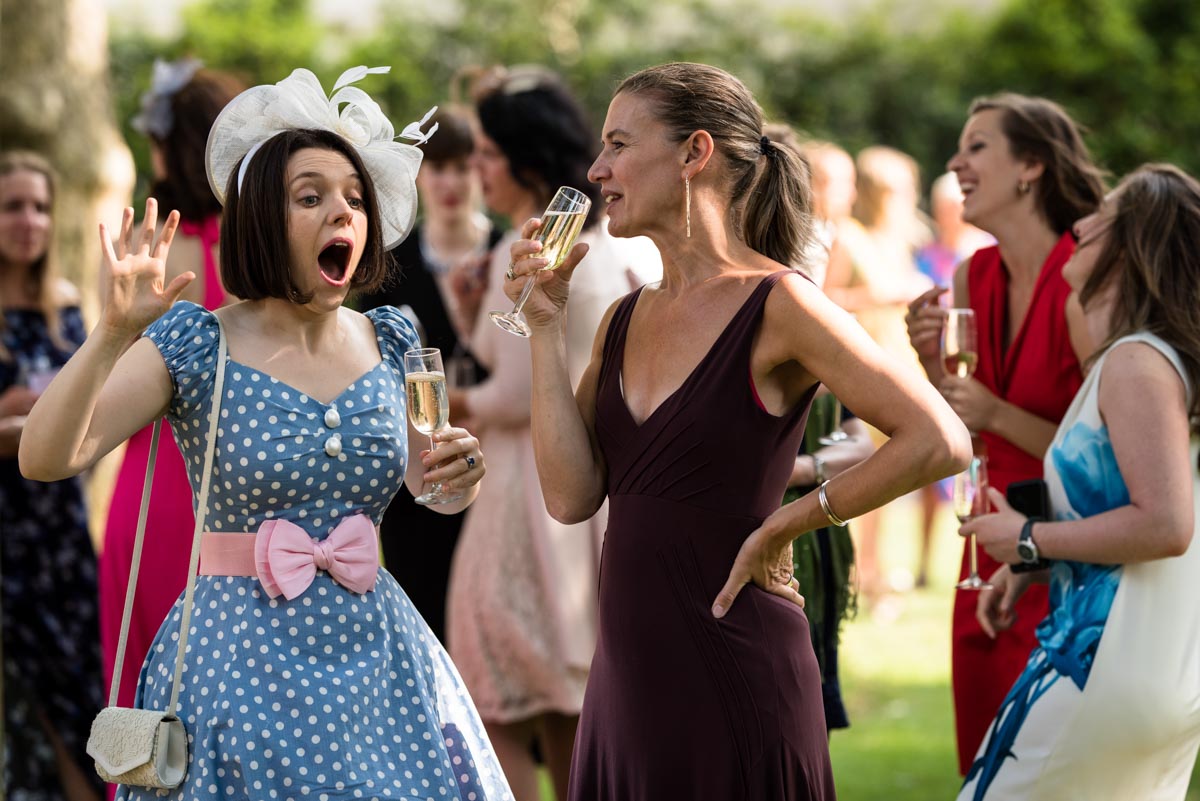 Wedding guests enjoying drinks at London wedding reception