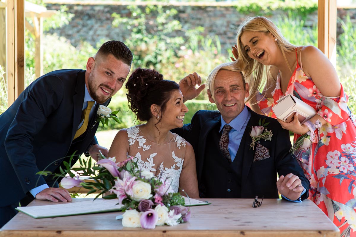 Signing the register, Secret garden wedding, Kent