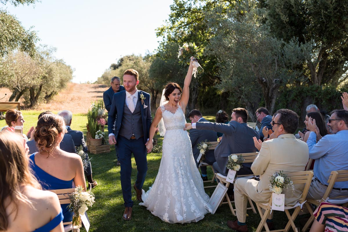 Rebecca celebrates after her wedding at castell d'emporda to matt