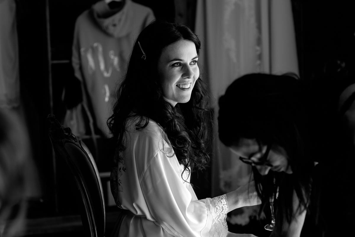 Photograph of Rebecca getting ready in the bridal suite of castell d'emporda wedding venue