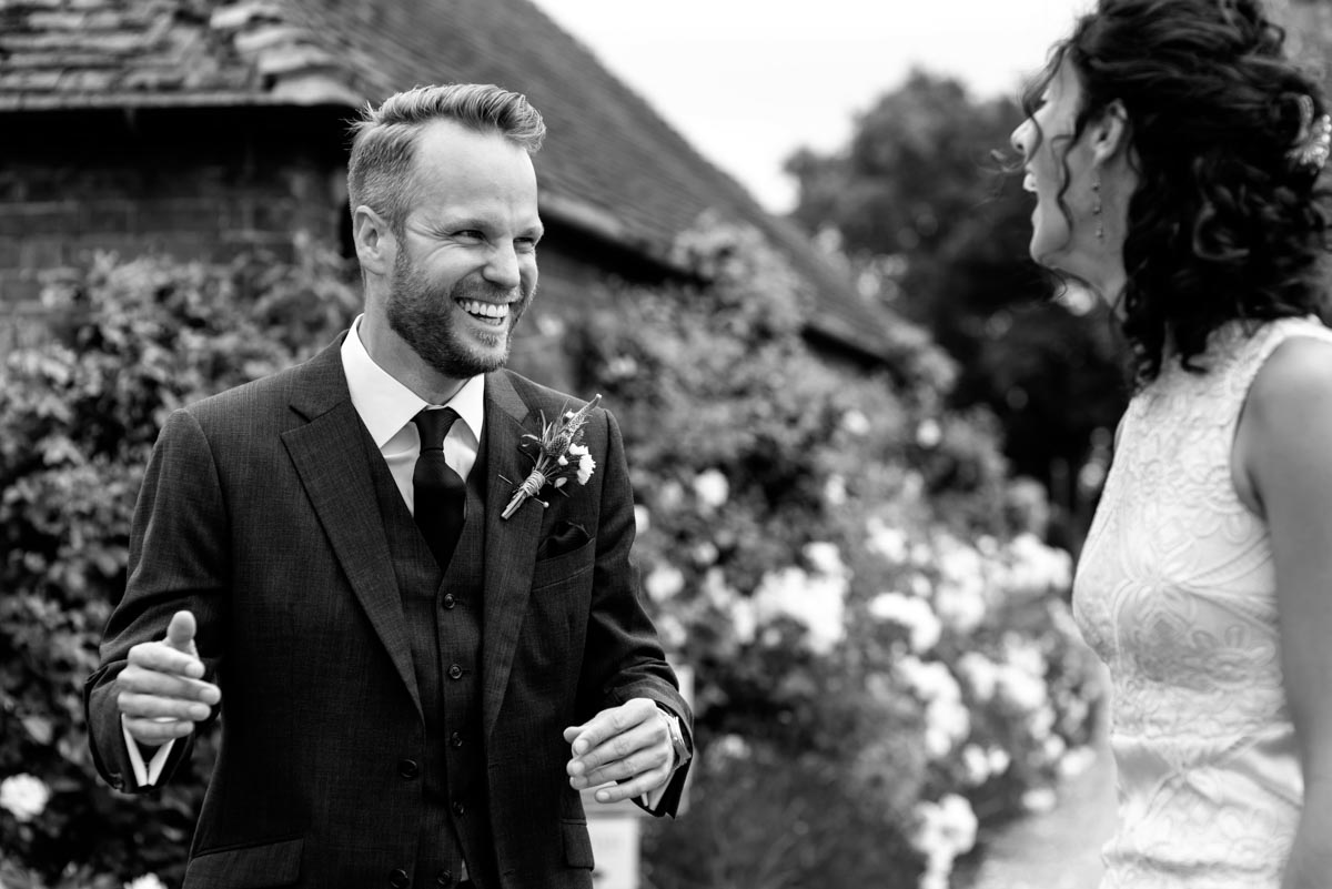 Odo's Barn wedding photography, Craig greets his friends before ceremony