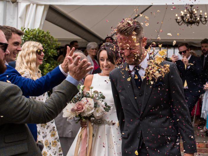 Odo's Barn wedding photography,Craig and Sarah have confetti thrown in their faces