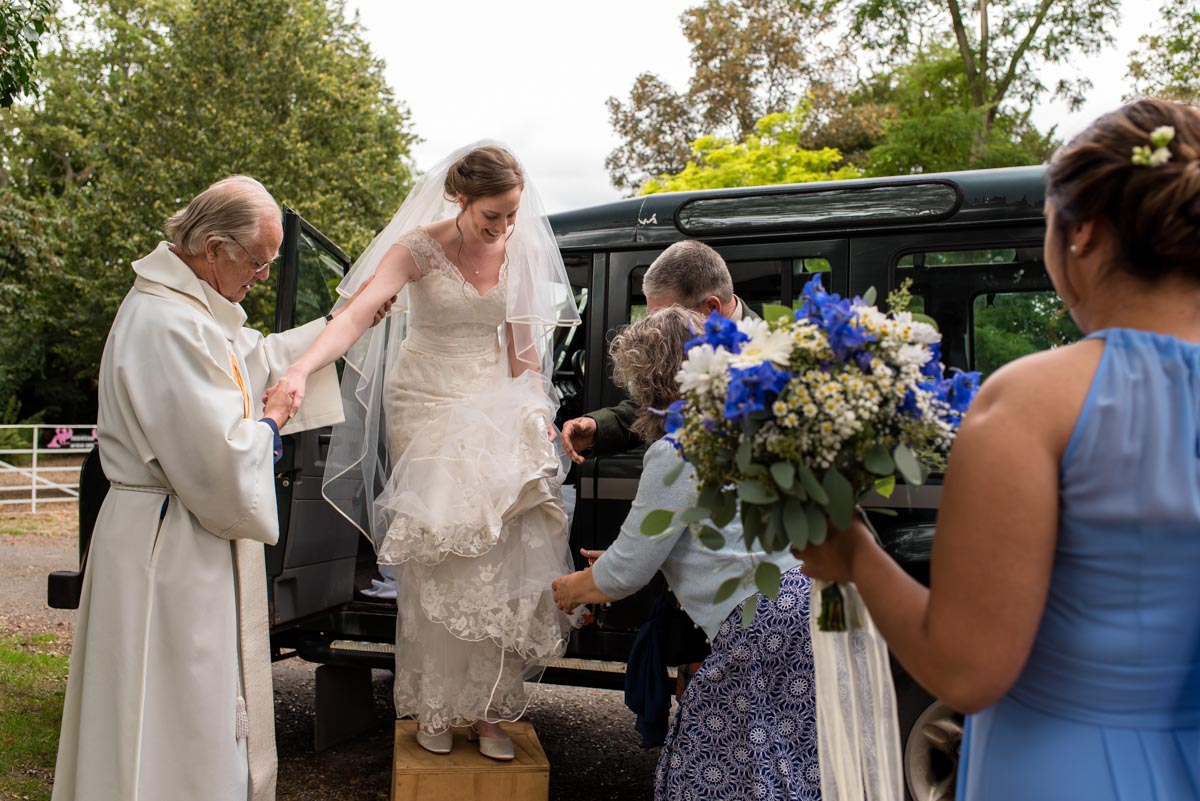 hannah helped out of wedding transport