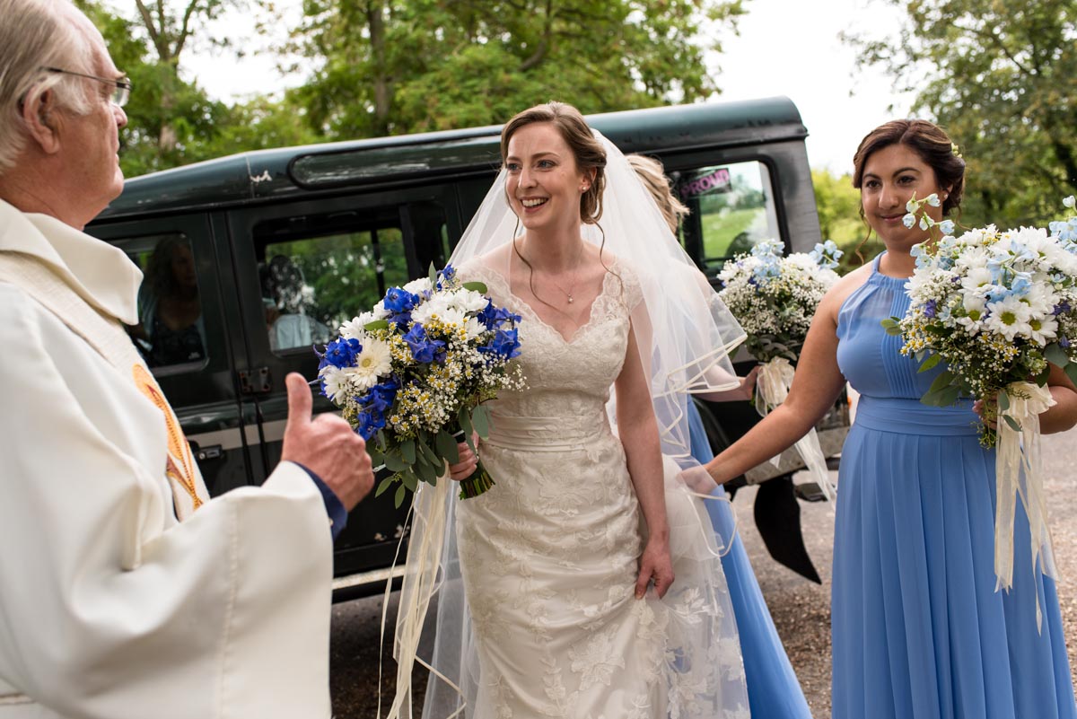 Canterbury wedding photography. Greeted by the vicar at church