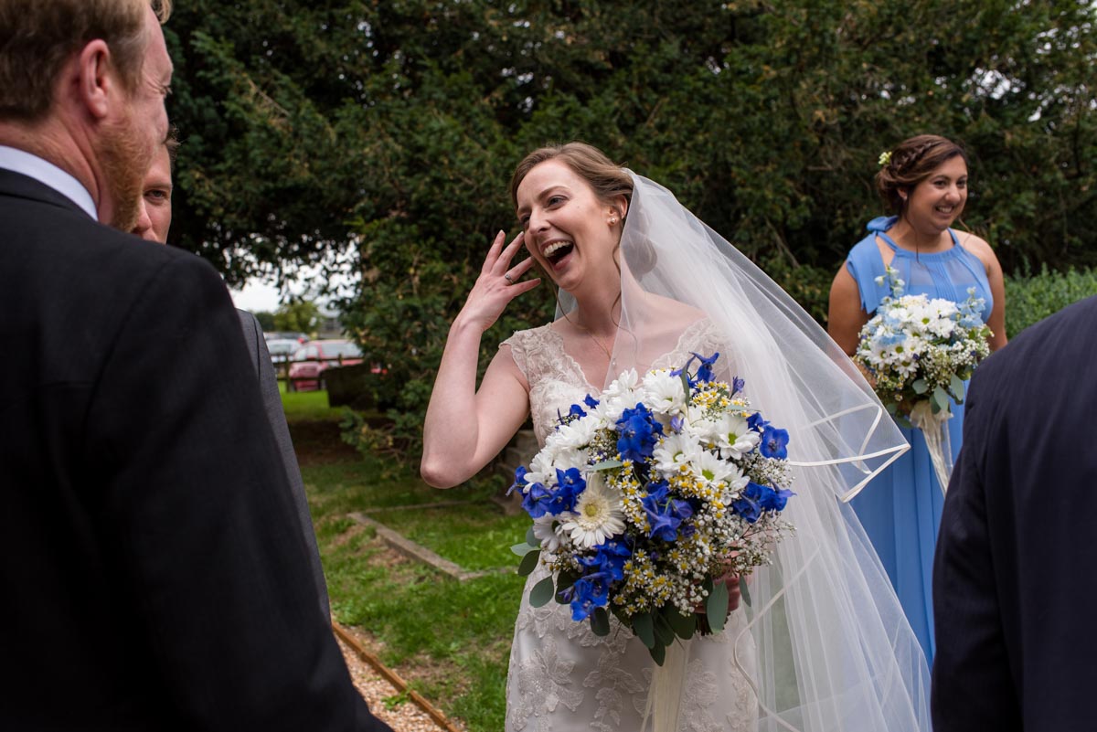 Canterbury wedding photography, greeting guests after the ceremony