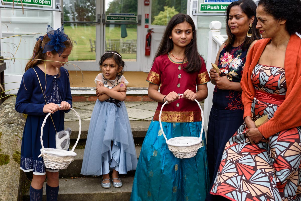 Flower girls ready for the confetti throw at Vinita and Dougs wedding at Chiston Park in Kent