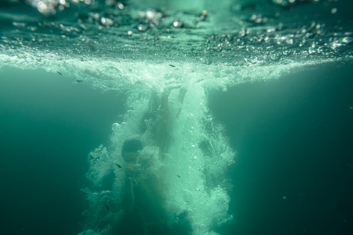 swimming and blowing bubbles in cenotes