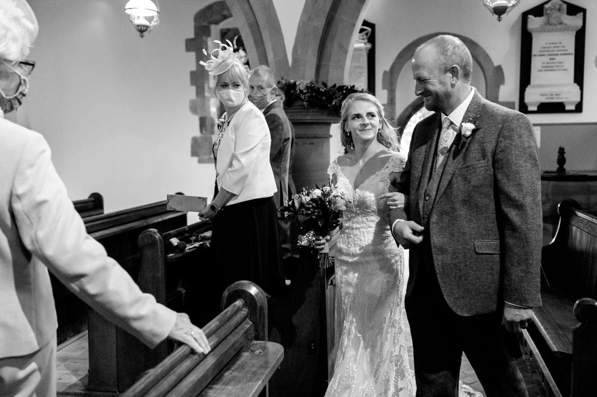 Rebecca is walked into church on her wedding day by her dad