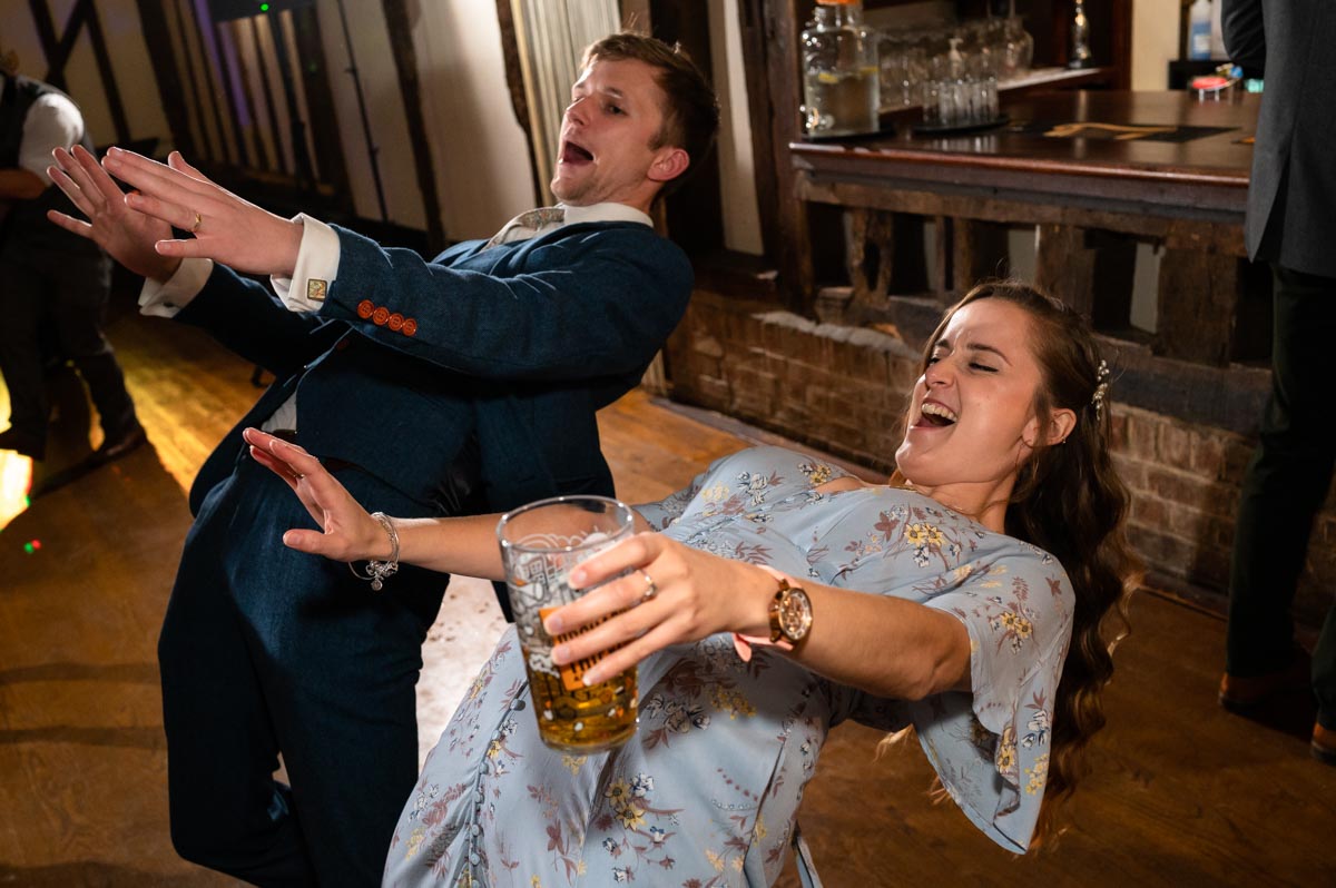 wedding photography best of 2021 photograph of groom and wedding guest dancing at wedding reception in tunbridge wells kent