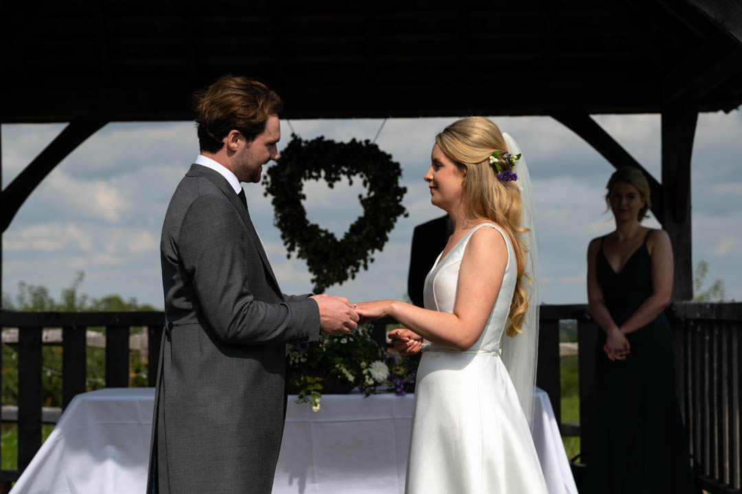 Fiona and Chris exchange wedding vows at The Cherry Barn in east Sussex