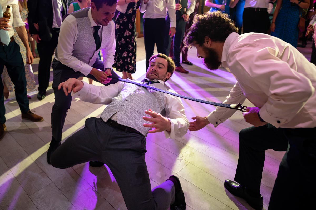 Limbo dancing at Chris and Fiona's wedding at The Cherry barn in East Sussex