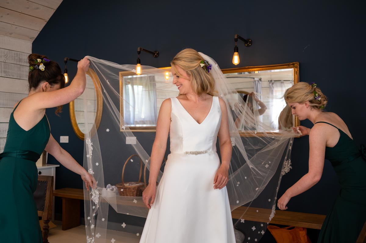 The Cherry Barn wedding. Fiona has her veil adjusted before the ceremony
