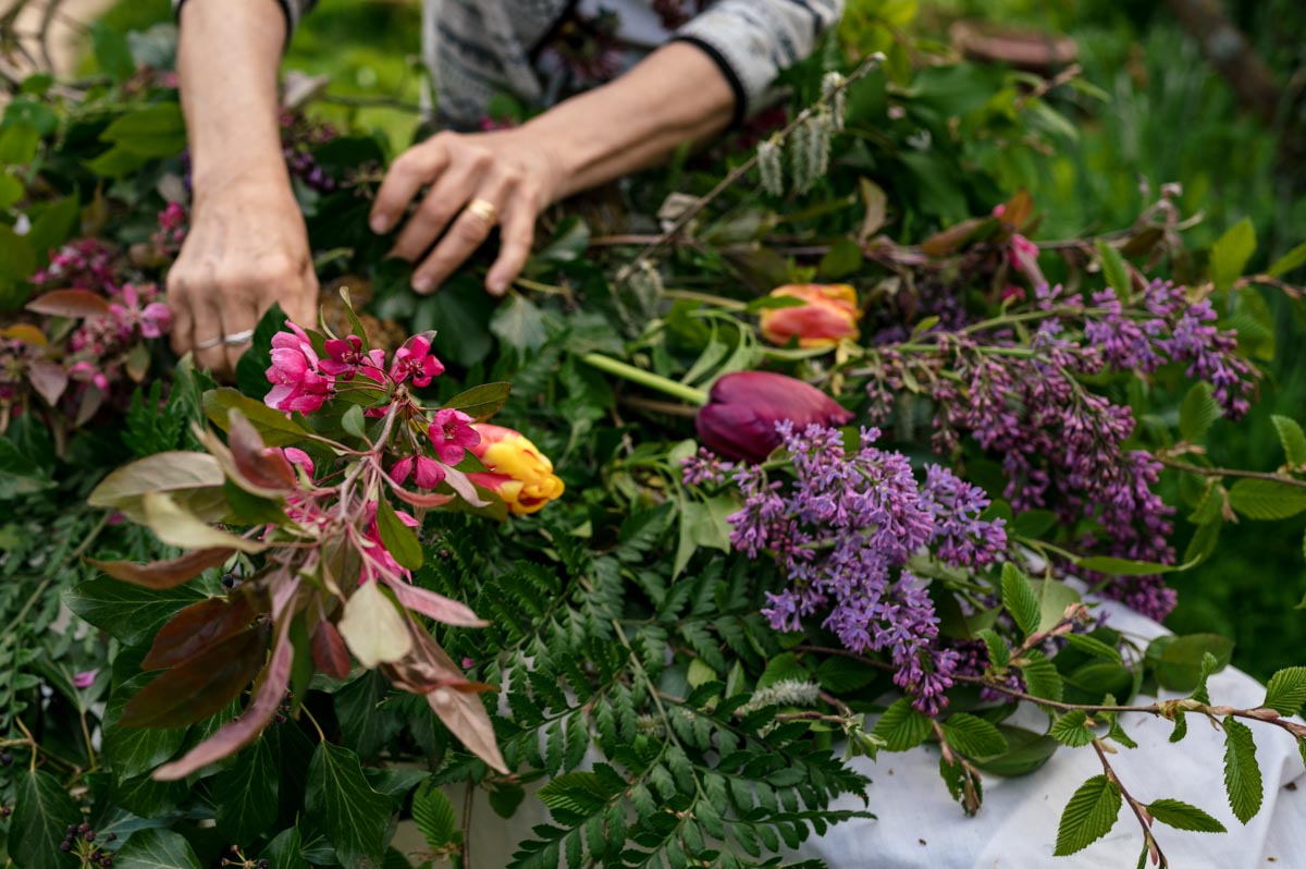 day in the life photography for business showing Lin putting together funeral bouquet