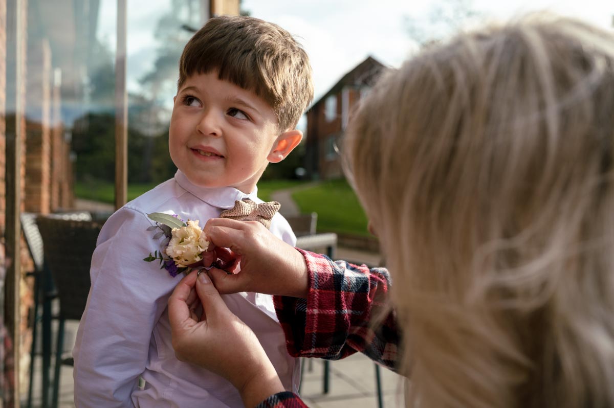 Page boy gets his button hole fixed