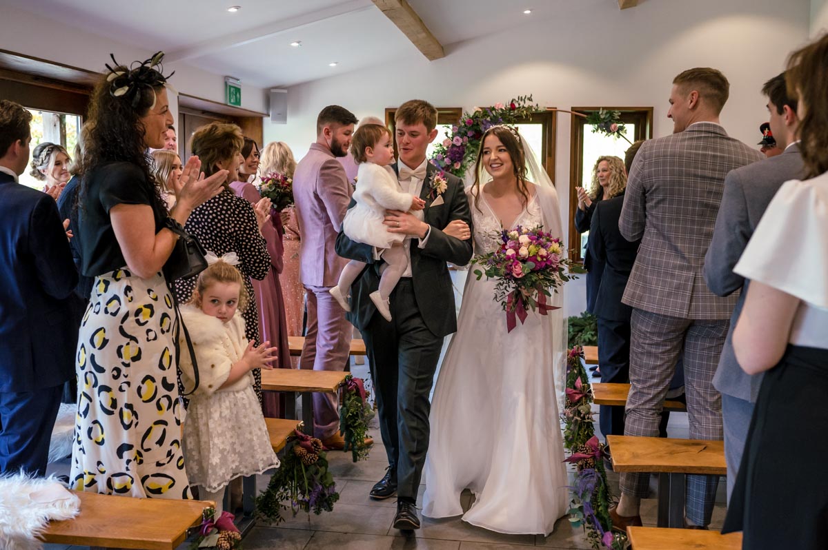 Will and Sophia leave The Oak barn, Frame farm wedding venue after their ceremony