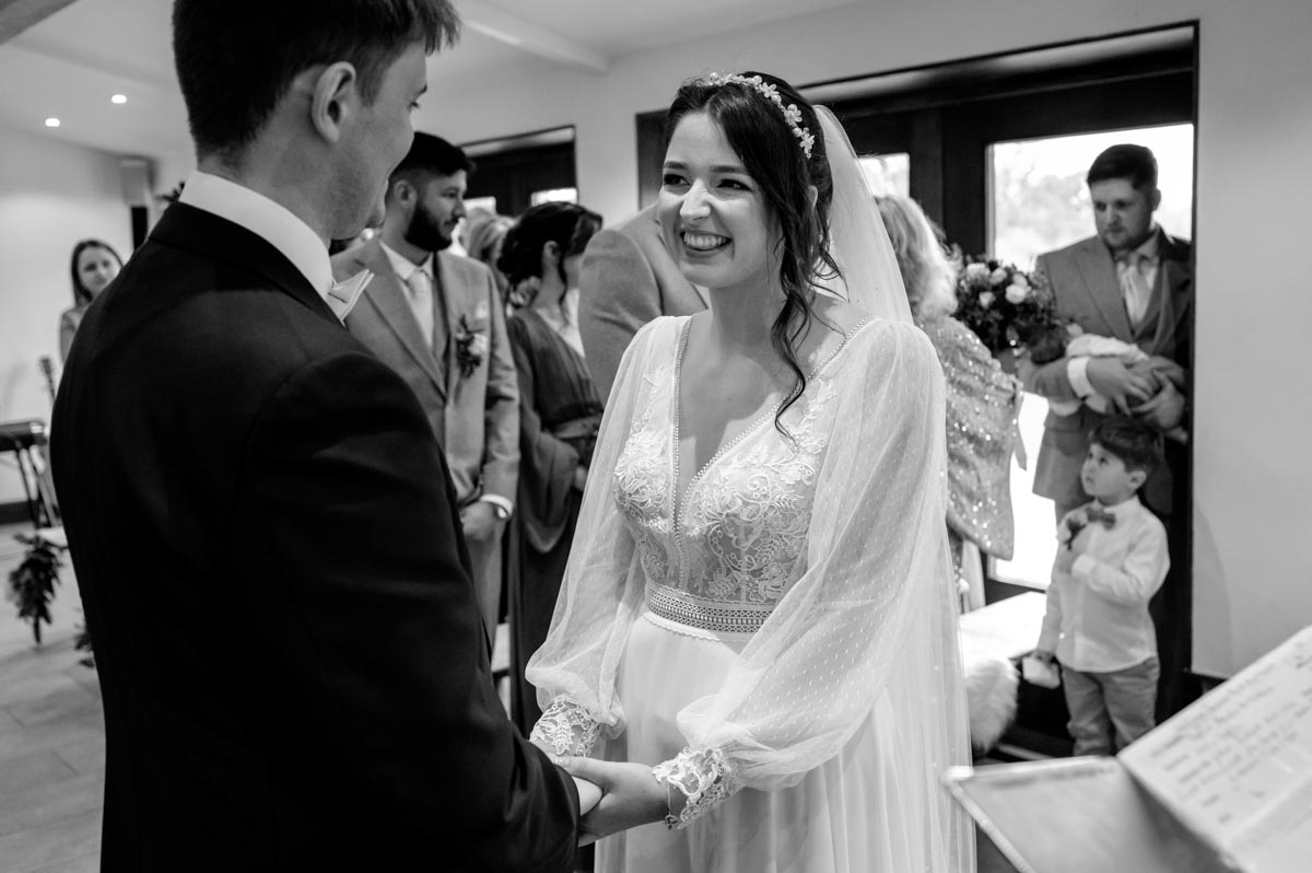 Black and white photograph of Sophia and Will at their Oak Barn, Frame farm wedding