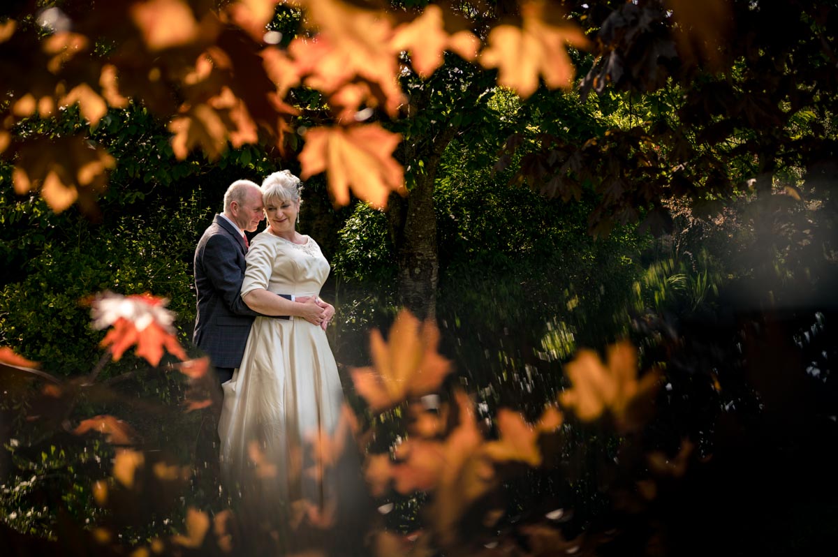 portrait of rachel and tony iat the secret garden in ashford, kent
