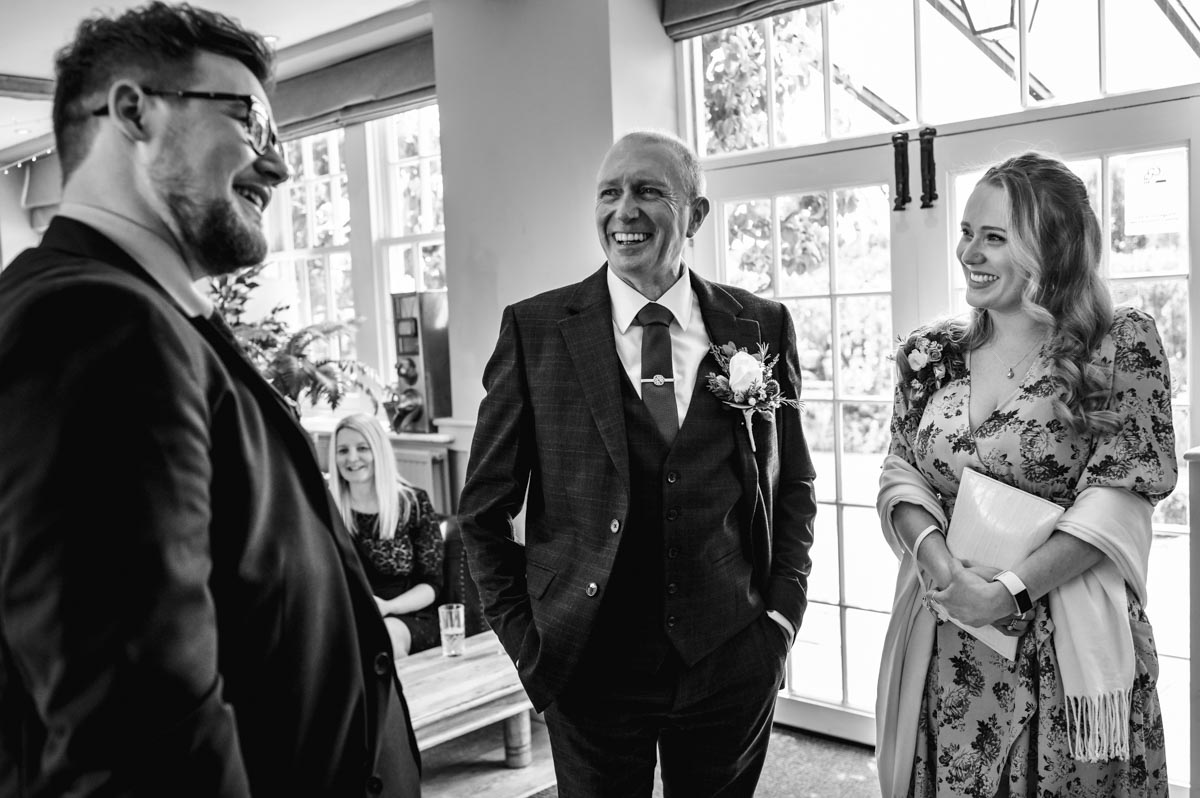 Black and white photograph of Tony, the groom at his secret garden wedding