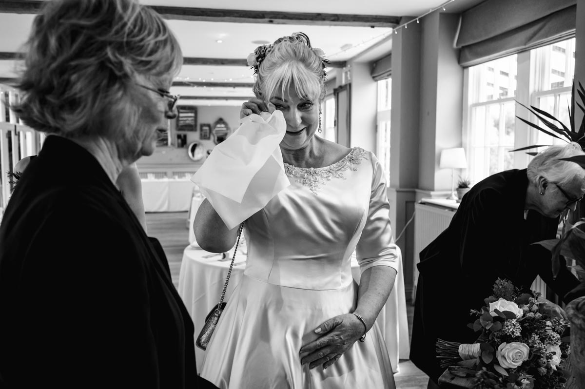 Rachel sheds a tear before her secret garden wedding